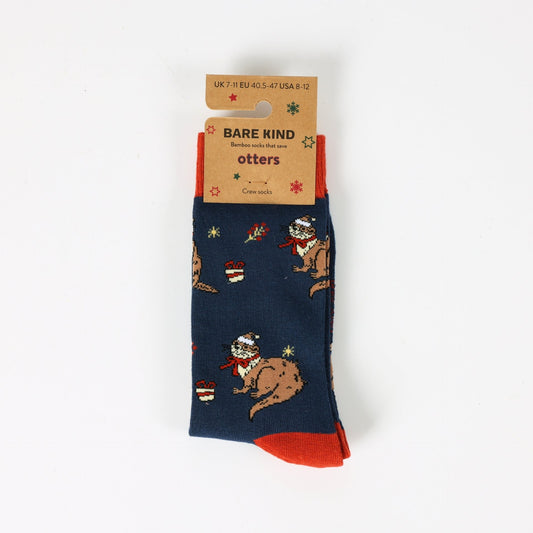 Navy blue socks with otter designs and red accents, featuring a Bare Kind label.