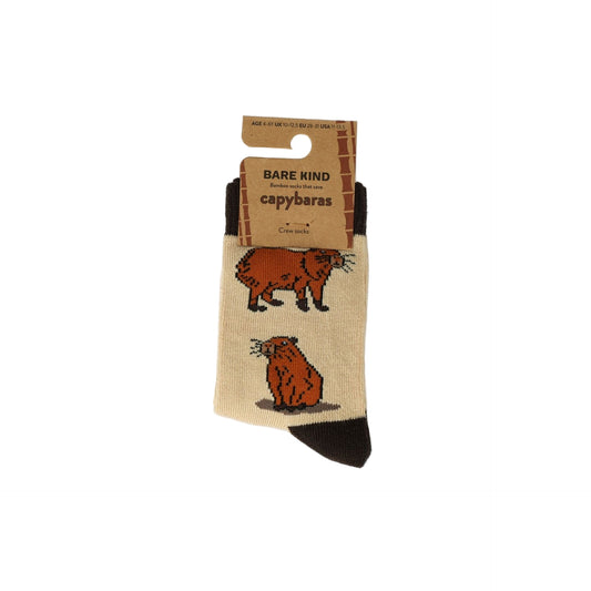 Capybara-themed socks with packaging on a white background