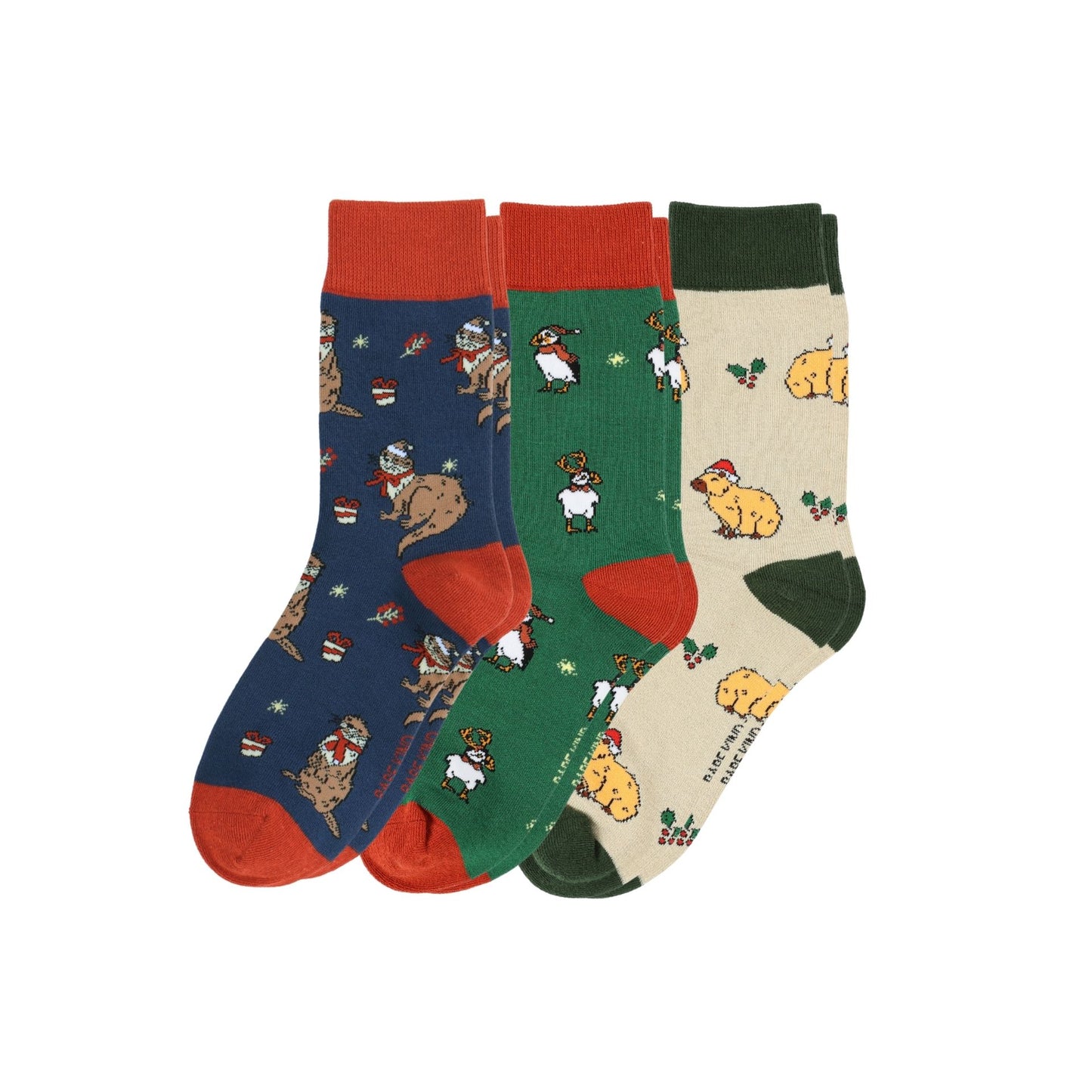 Three pairs of patterned socks with different designs on a white background