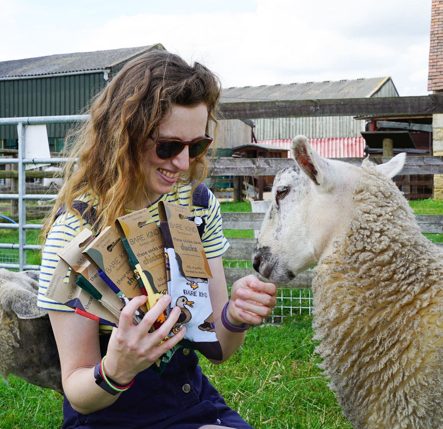 Lucy with a sheep and bamboo socks