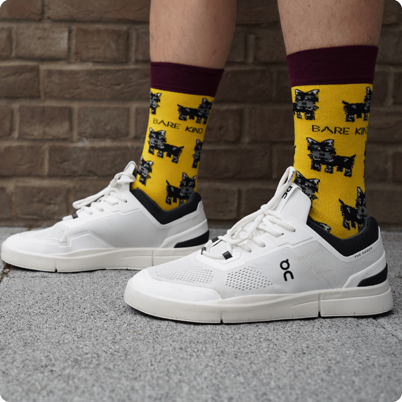 Model wearing Highland dog bamboo socks