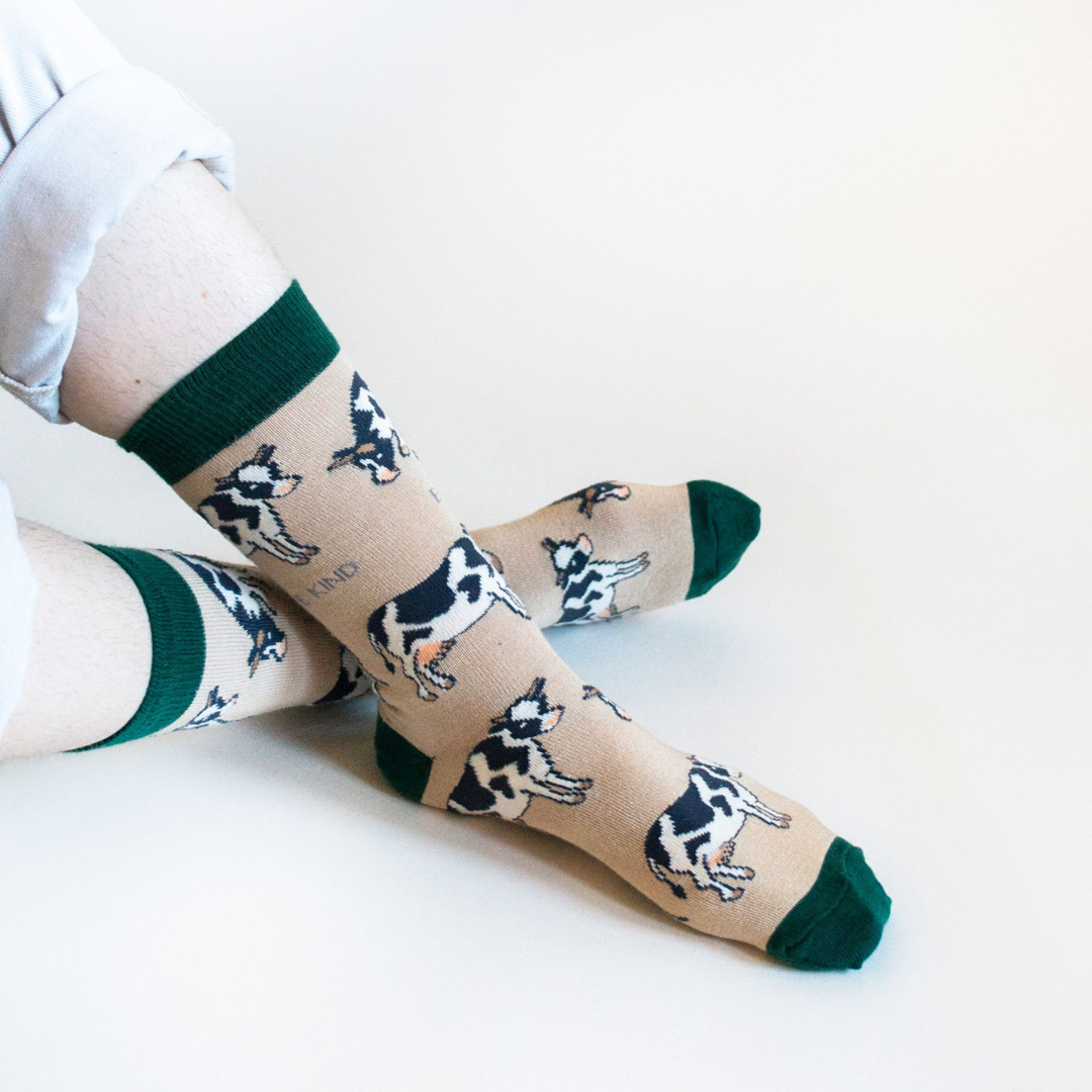 Model wearing cow bamboo socks