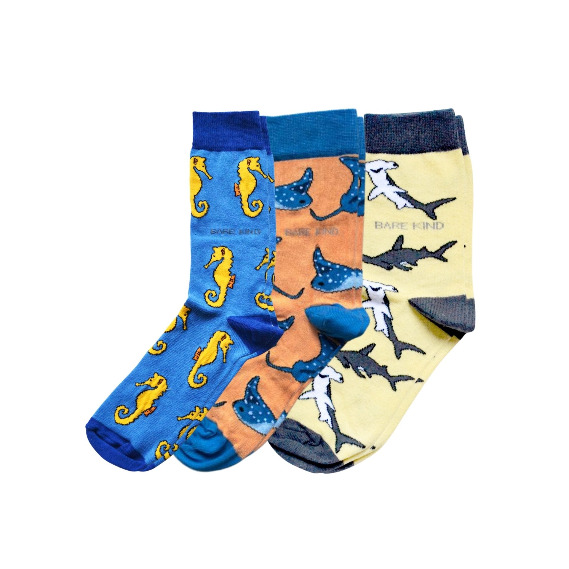 Three pairs of socks with animal patterns on a white background