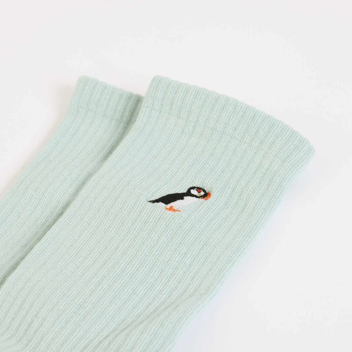 flat lays of blue puffin ribbed bamboo socks