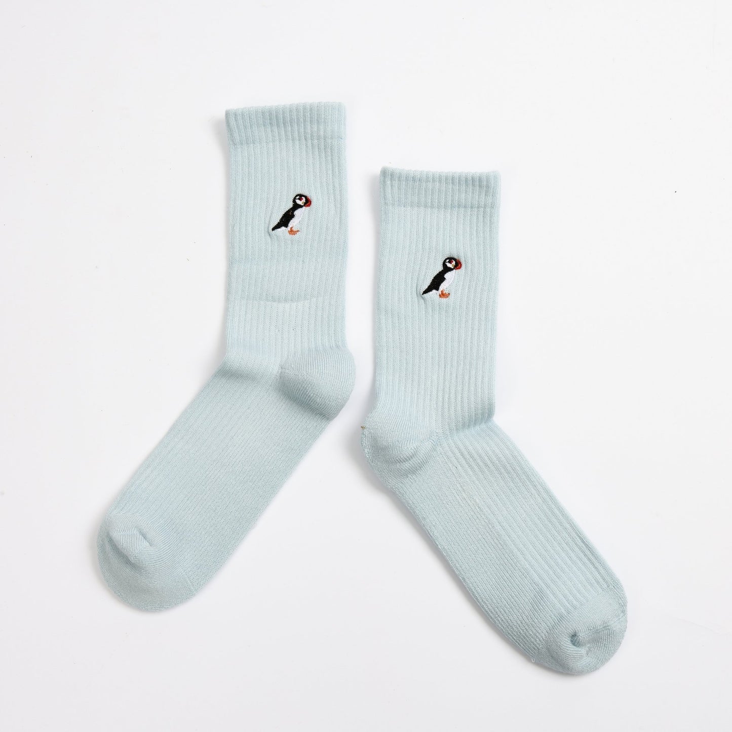 flat lays of blue puffin ribbed bamboo socks