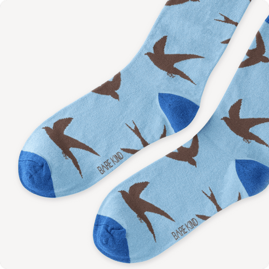 Blue socks with Swift pattern on a white background