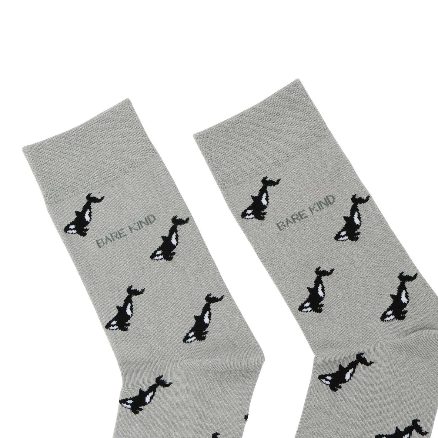 Gray socks with black animal prints and 'Bare Kind' text on a white background