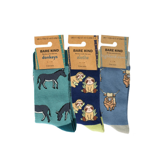 Three pairs of socks with animal patterns on packaging labeled 'Bare Kind'.