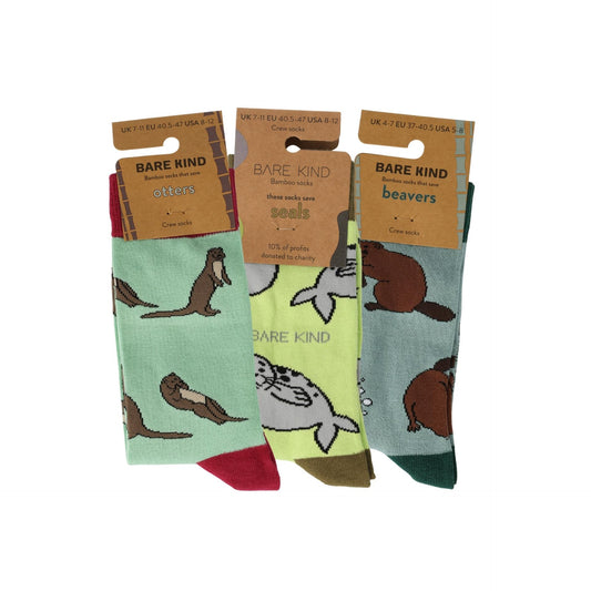 Set of three pairs of socks with animal designs on a white background