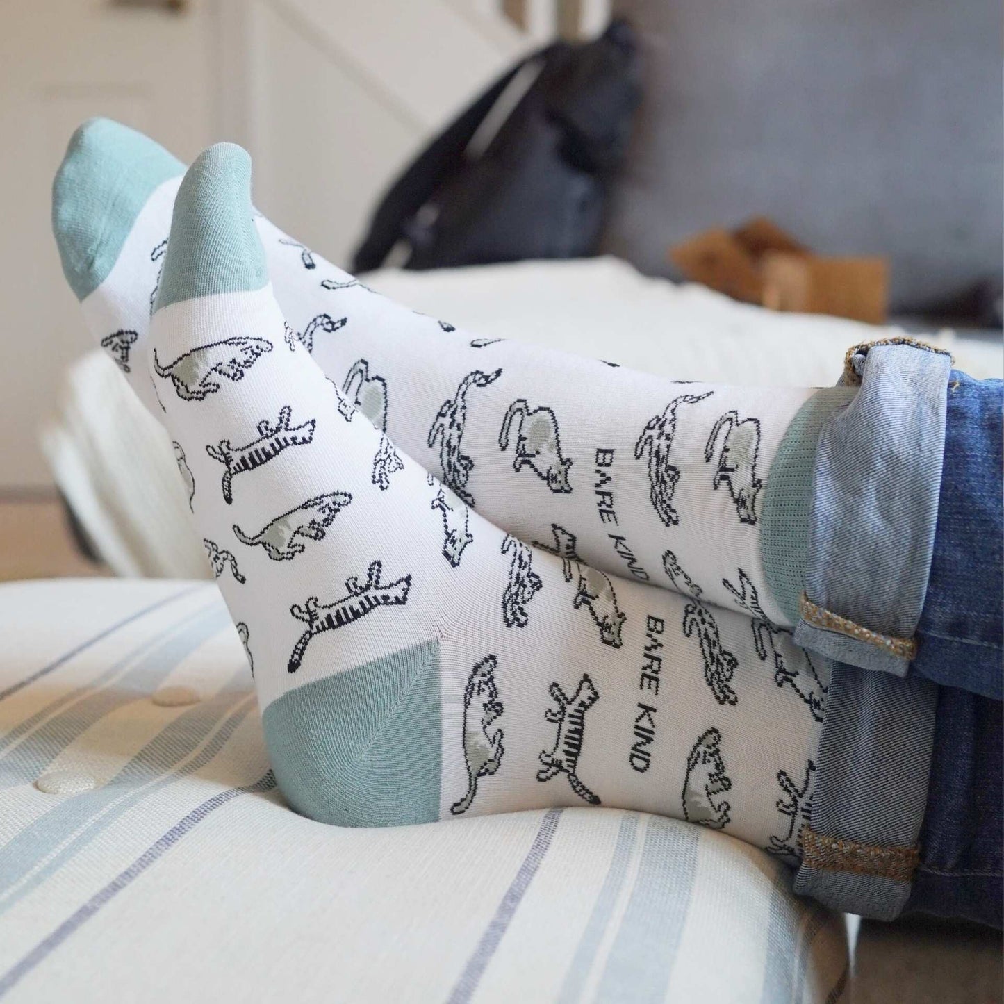 model wearing green cat bamboo socks