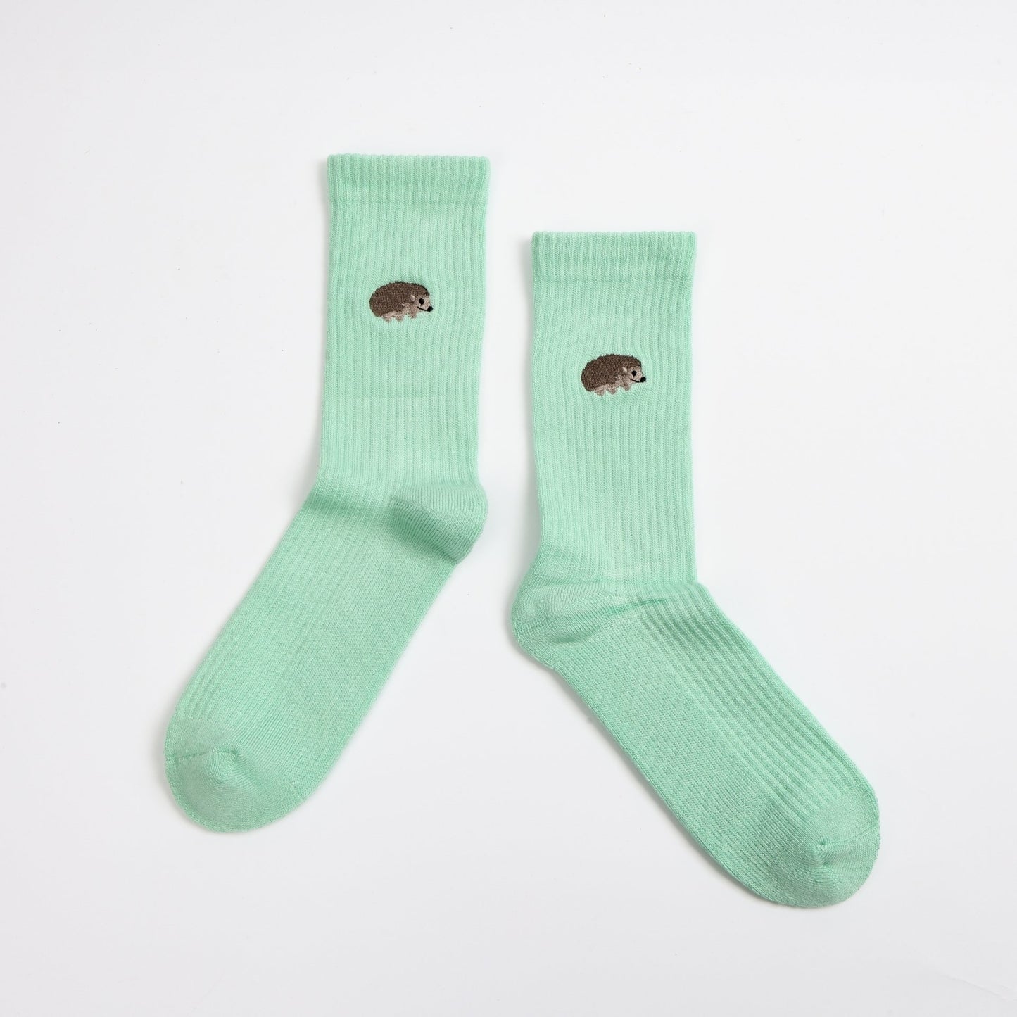 flat lays of green hedgehogs ribbed bamboo socks