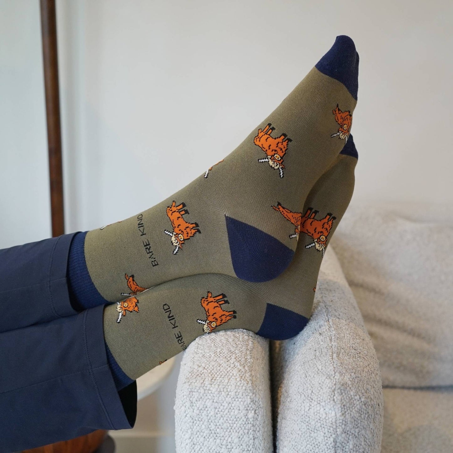 model wearing green highland cows bamboo socks