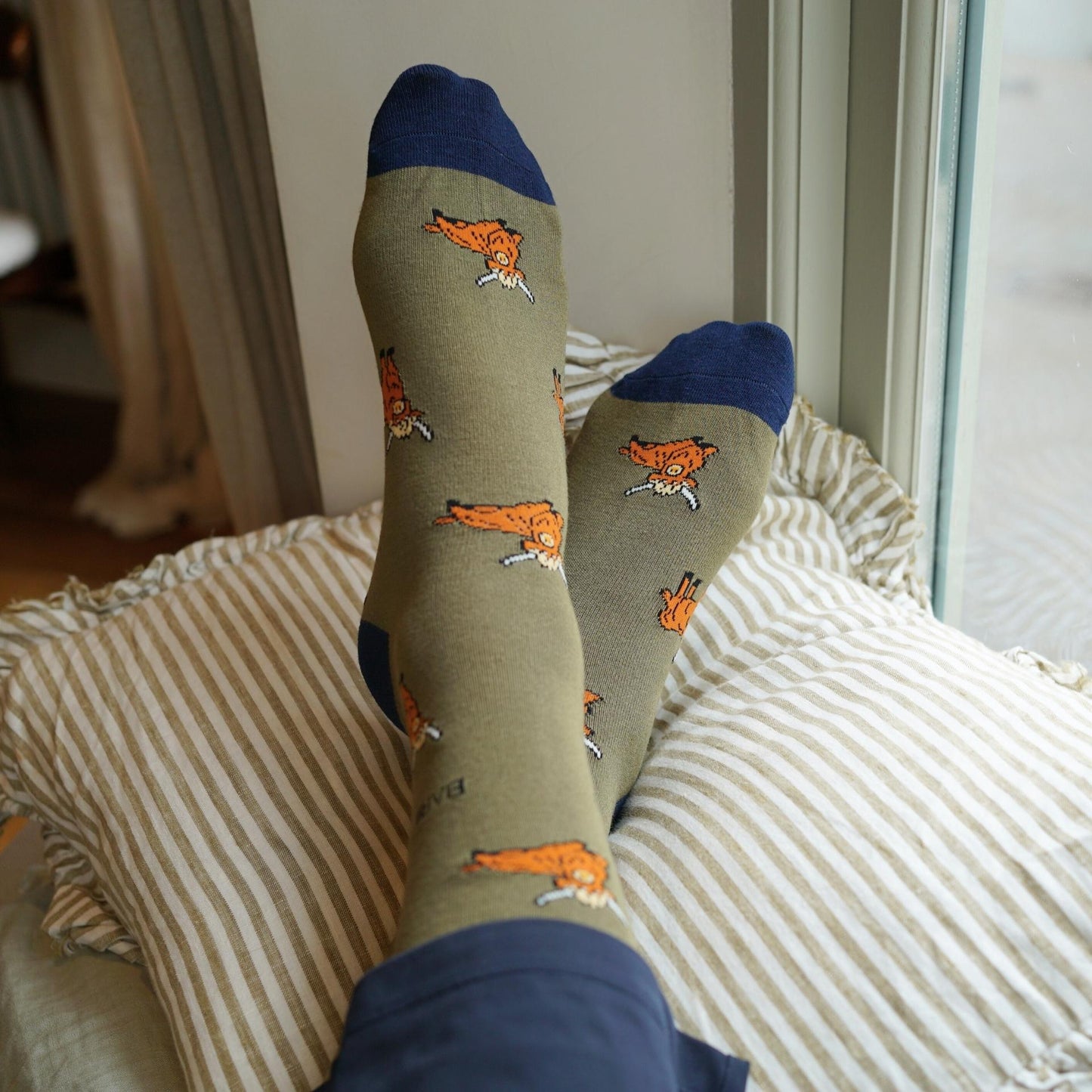 model wearing green highland cows bamboo socks