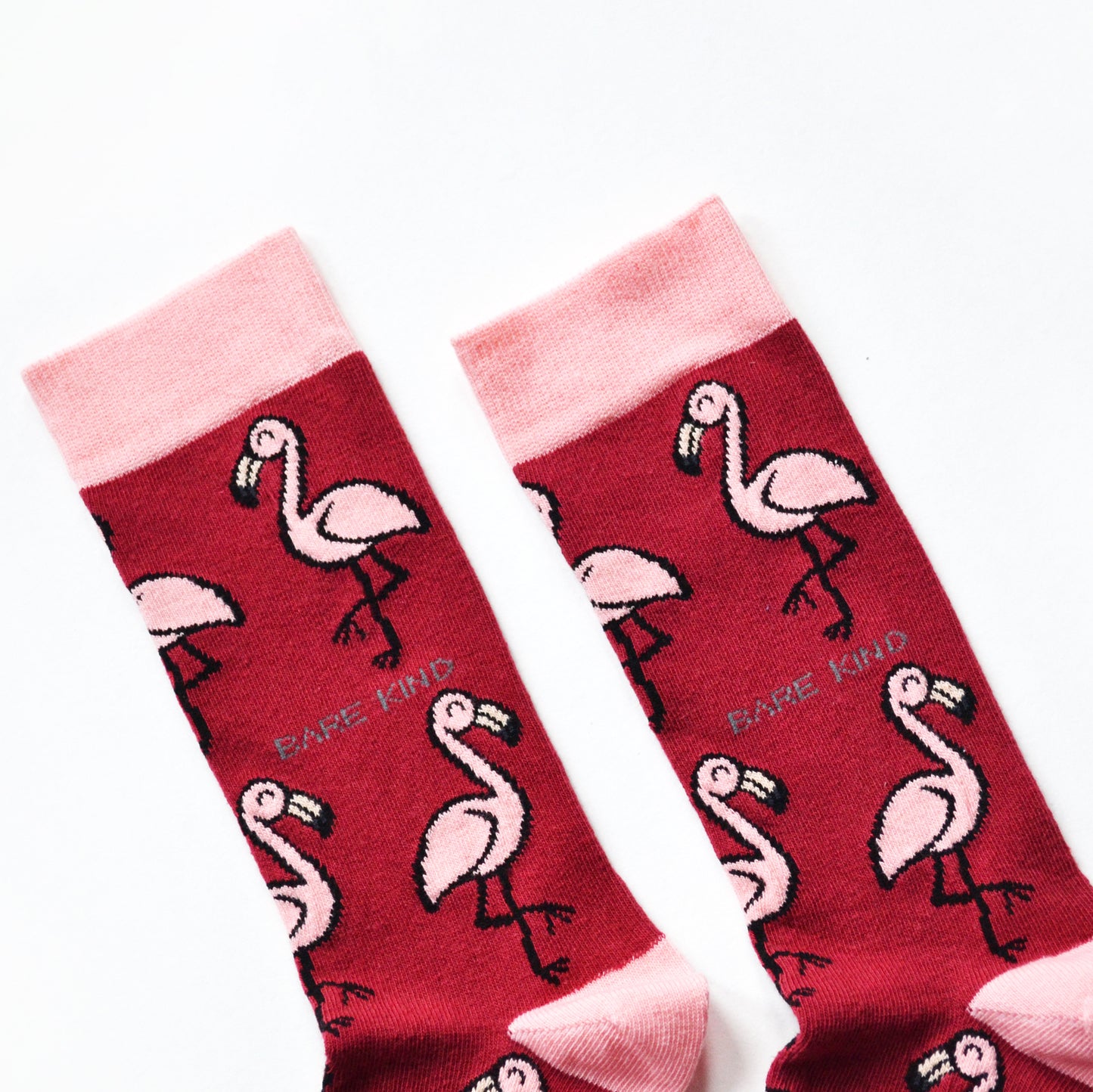 cuff closeup flat lay of hot pink flamingo socks