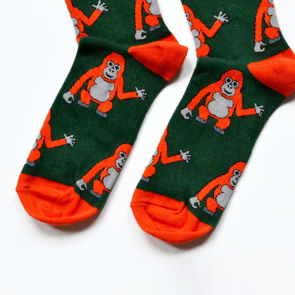 toe closeup flat lay of dark green bamboo orangutan socks