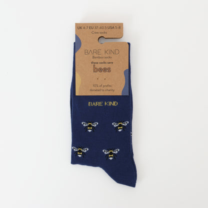 Flat lay of Bare Kind bamboo socks packaging, featuring small motifs of bees