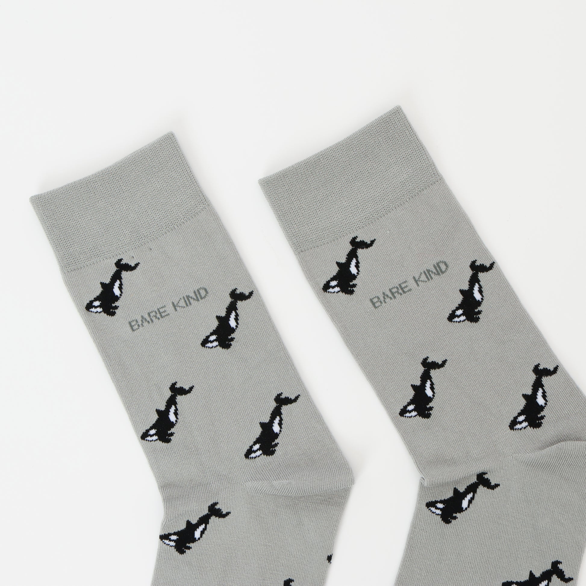 Close up to Bare Kind bamboo socks, featuring small motifs of orcas