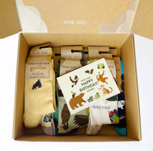 Closeup look of birthday box featuring colourful bamboo socks and a happy birthday card
