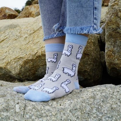model wearing grey blue alpaca bamboo socks