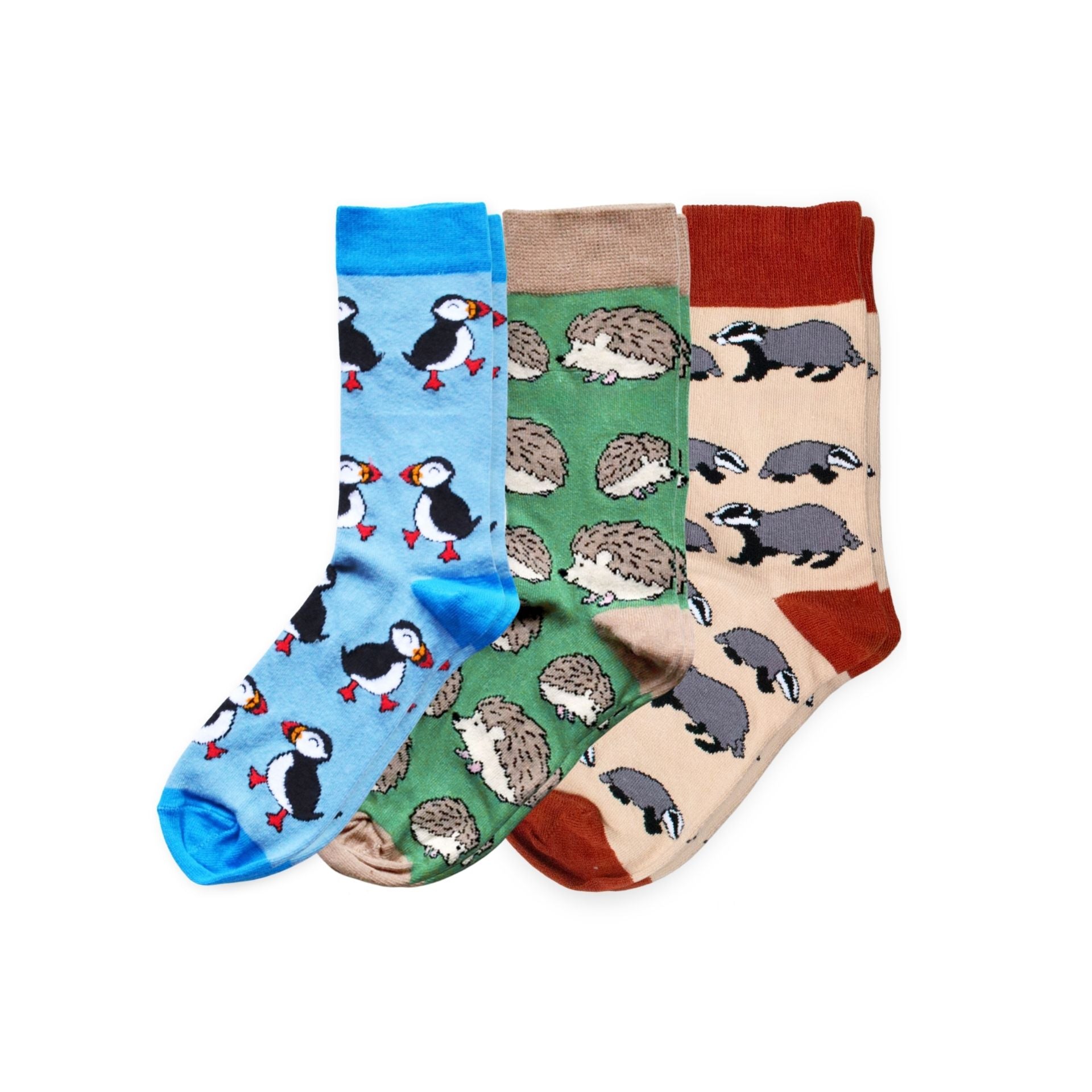 Three pairs of socks with animal patterns on a white background