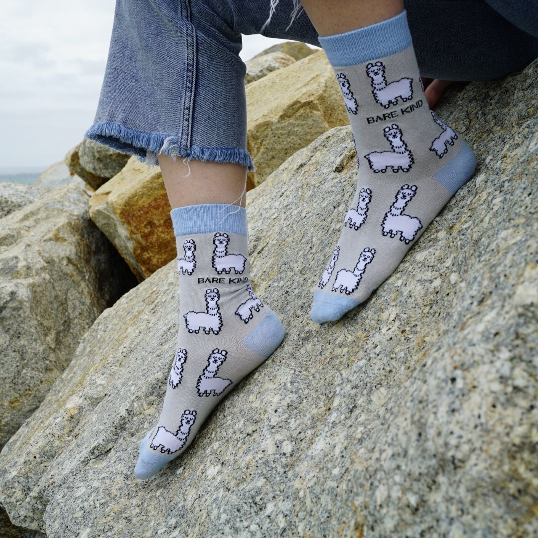 model wearing grey blue alpaca bamboo socks