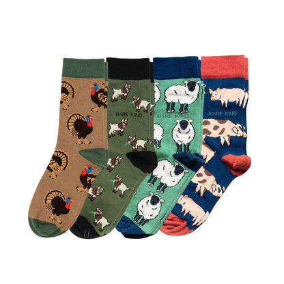 Set of four colorful socks with animal patterns on a white background