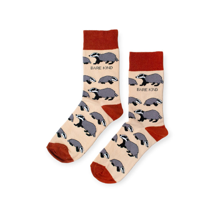 flat lay of beige and terracotta bamboo socks featuring a badger design