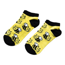 yellow and black flat lay of bamboo trainer socks in bumblebee design
