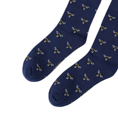 Navy blue socks with bee pattern on a white background