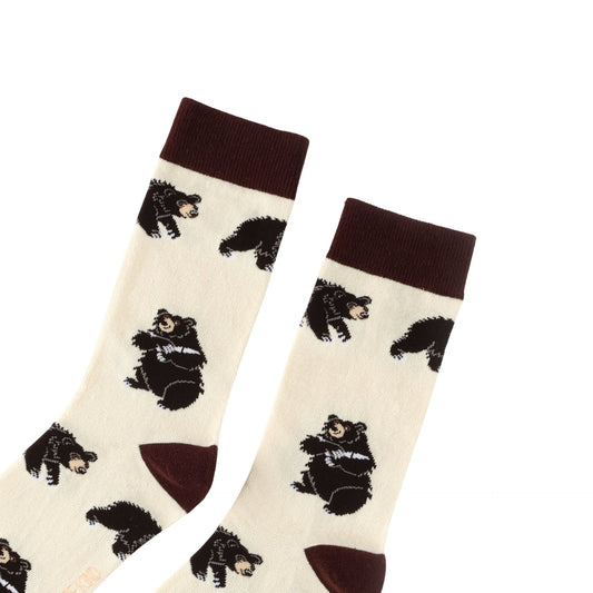 Pair of socks with bear pattern on a white background