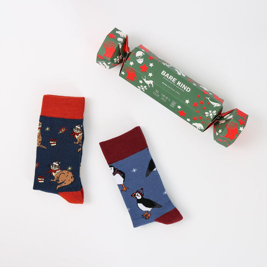 Two pairs of patterned socks with a 'Bare Kind' branded box on a white background
