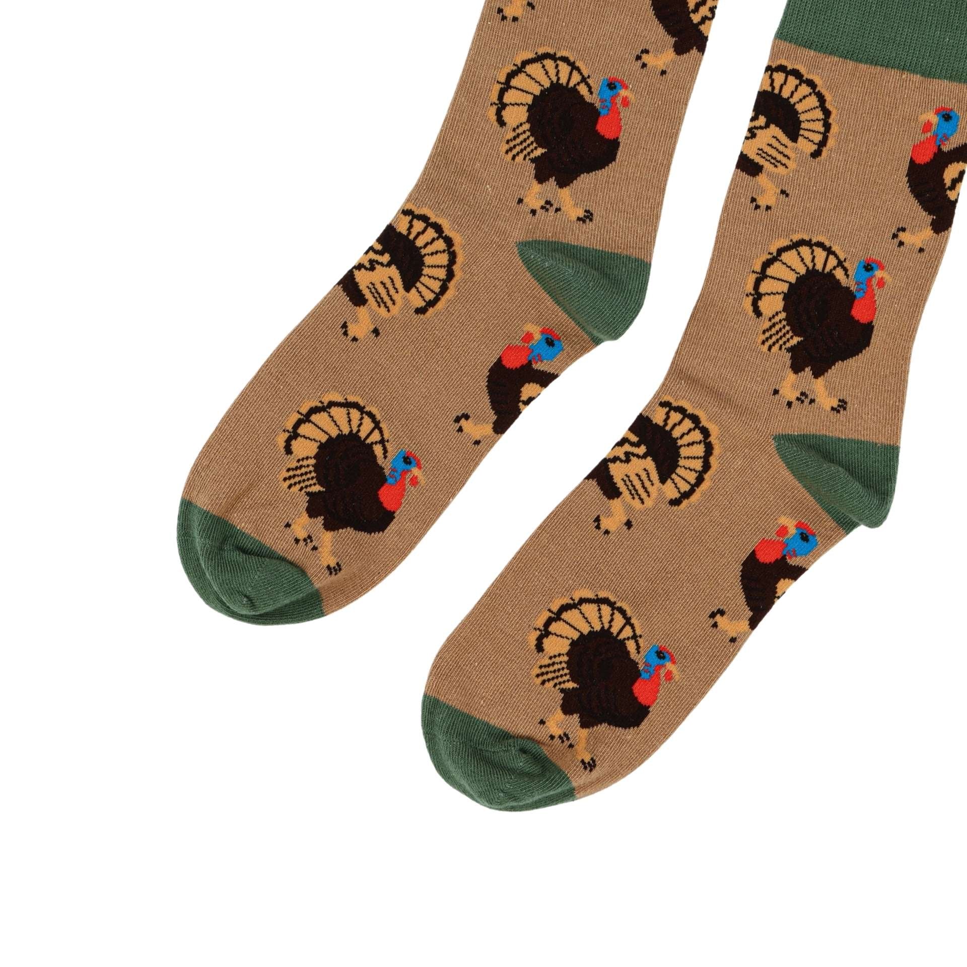 Brown socks with turkey pattern on a white background