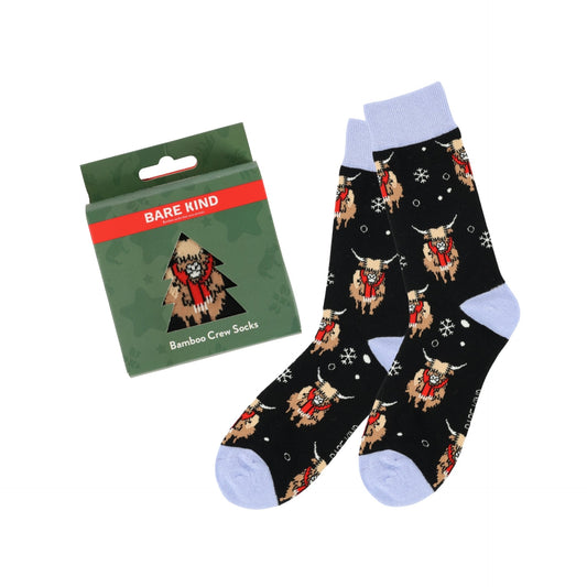 Christmas Highland Cow socks with packaging on a white background