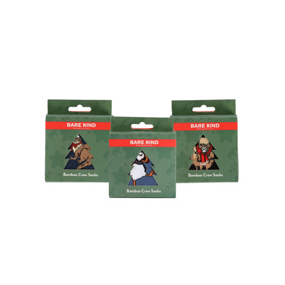 Three packages of Christmas bamboo crew socks on a white background