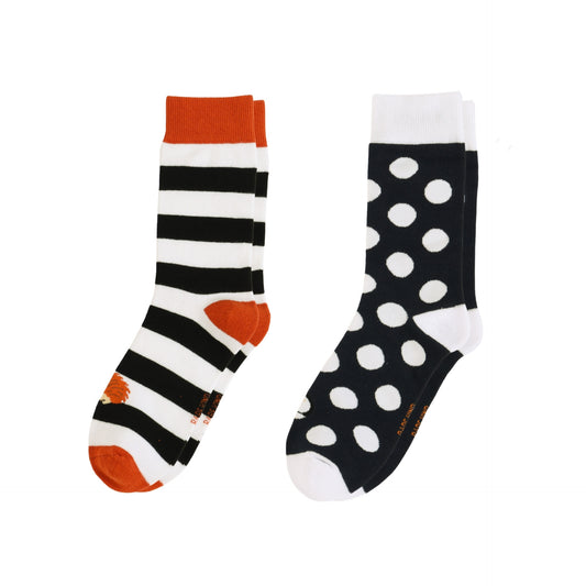 Two pairs of socks with striped and polka dot patterns on a white background