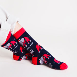sitting model wearing christmas elephant socks