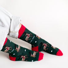 model wearing bamboo christmas socks featuring reindeer design