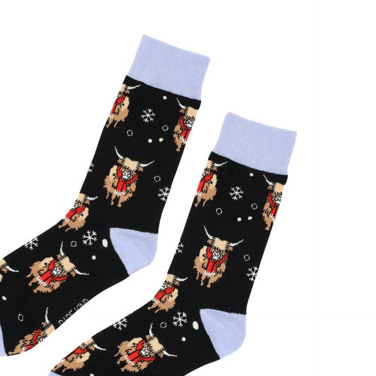 flat lay of christmas highland cows bamboo socks