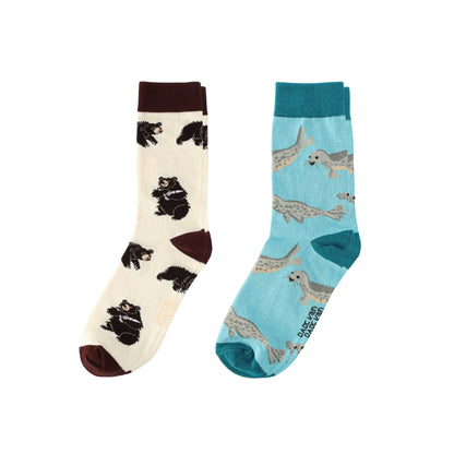 Two pairs of socks with animal patterns on a white background