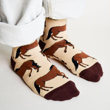 side angle view of standing model wearing bamboo horse socks