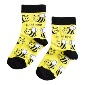 flat lay of yellow and black bamboo bee socks for kids
