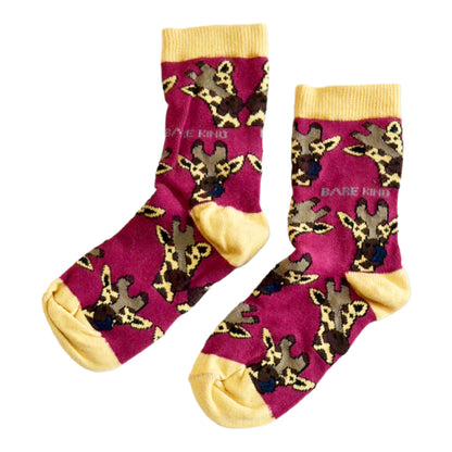 flat lay of burgundy giraffe bamboo socks for kids