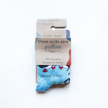 folded flat lay of blue puffin bamboo socks for kids in 100% recyclable packaging