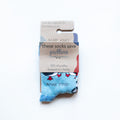 folded flat lay of blue puffin bamboo socks for kids in 100% recyclable packaging