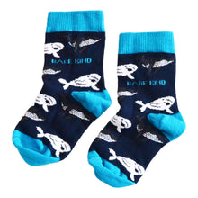 flat lay of blue bamboo whale socks for kids