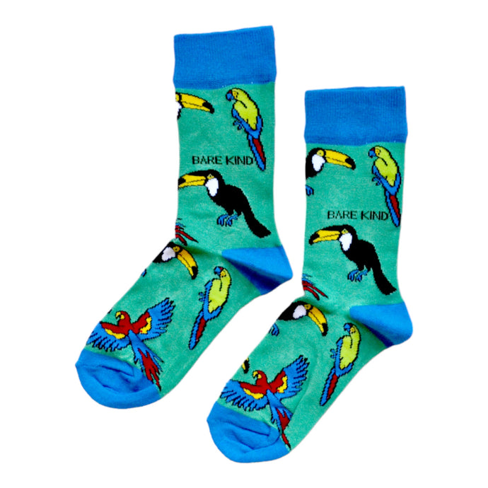 flat lay of green and blue tropical bird (toucan) bamboo socks
