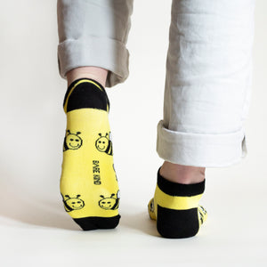 sole view of standing model wearing bee bamboo trainer and ankle socks