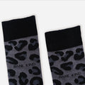 cuff closeup flat lay of black panther print socks