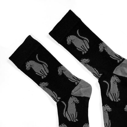 cuff closeup flat lay of soft top black panther crew socks for adults