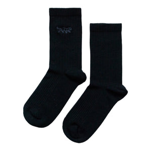 flat lay of ribbed black bamboo socks with panther embroidery on the cuff